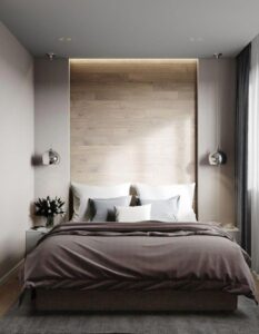 dormitorio con luz de acento en respaldo de cama