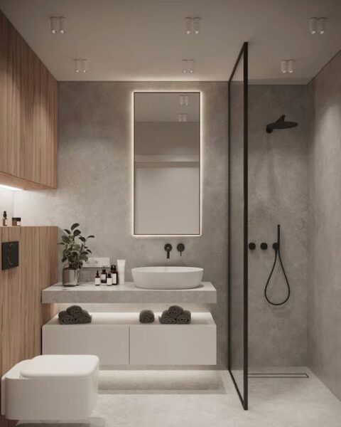 baño moderno con piso y pared de microcemento